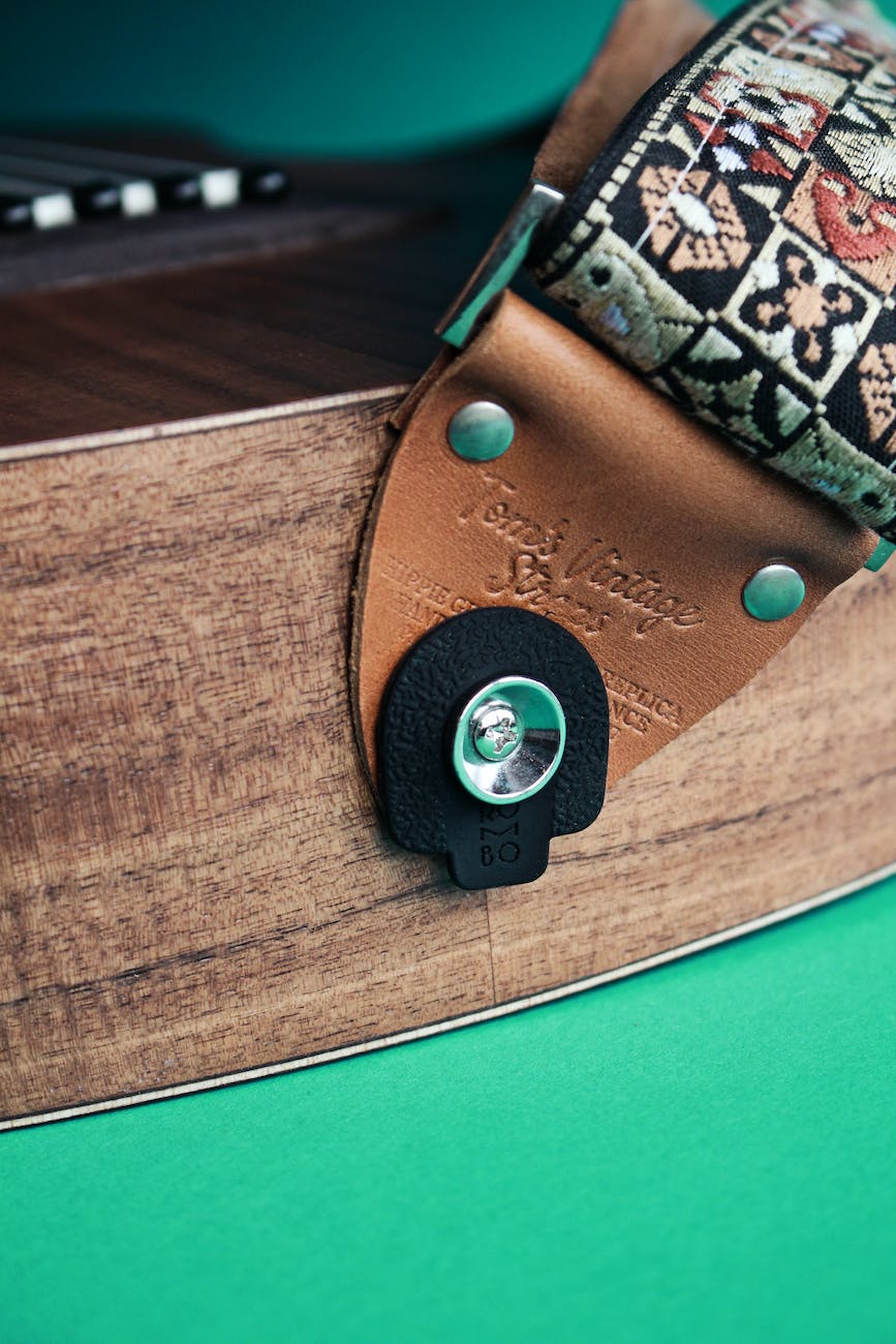 A Step-by-Step Guide: How to Put on a Guitar  Strap on Your Acoustic Guitar for Optimal Comfort and Performance